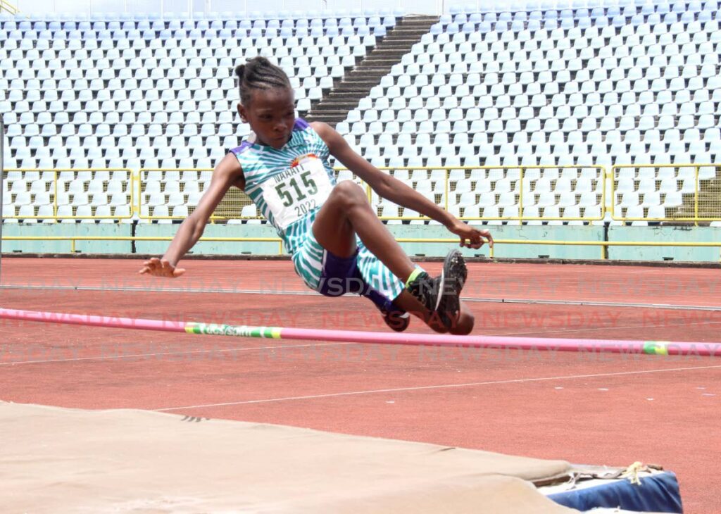 RSS Phoenix’s Nashequa Samuel leaps over the bar in the girls under 11 high jump NGC/Republic Bank/NAAATT Juvenile Championships at the Hasely Crawford Stadium, Port of Spain, on Sunday. Photo by Ayanna Kinsale