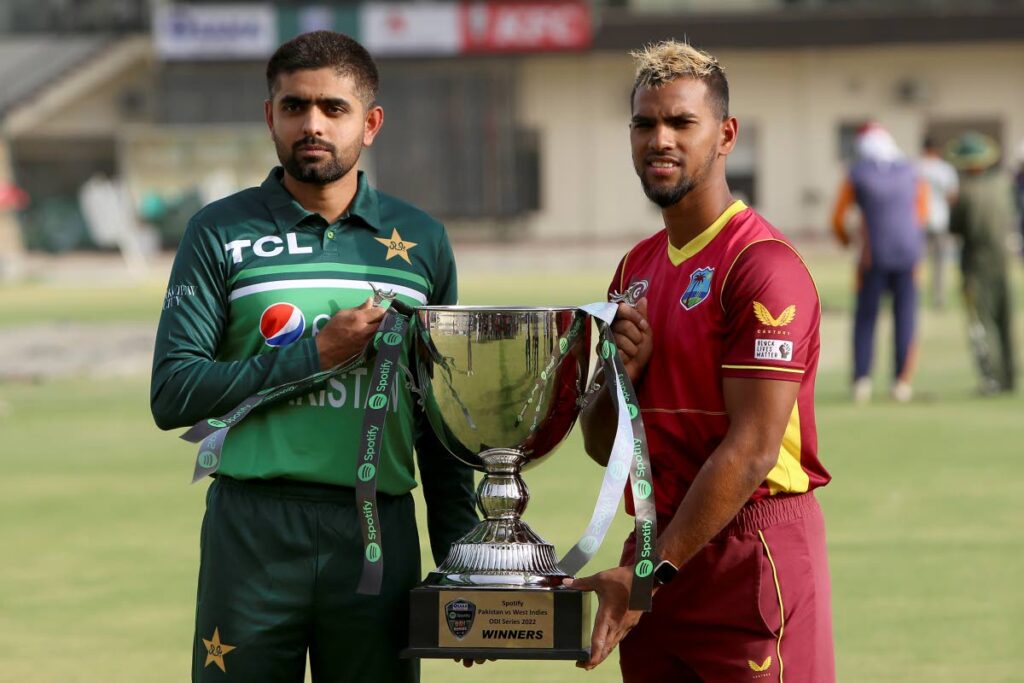Pakistani cricket team skipper Babar Azam (left), and his West Indies counterpart Nicholas Pooran pose for a photo with the ODI series trophy at the Multan Stadium, in Multan, Pakistan, on Tuesday. (AP PHOTO) 