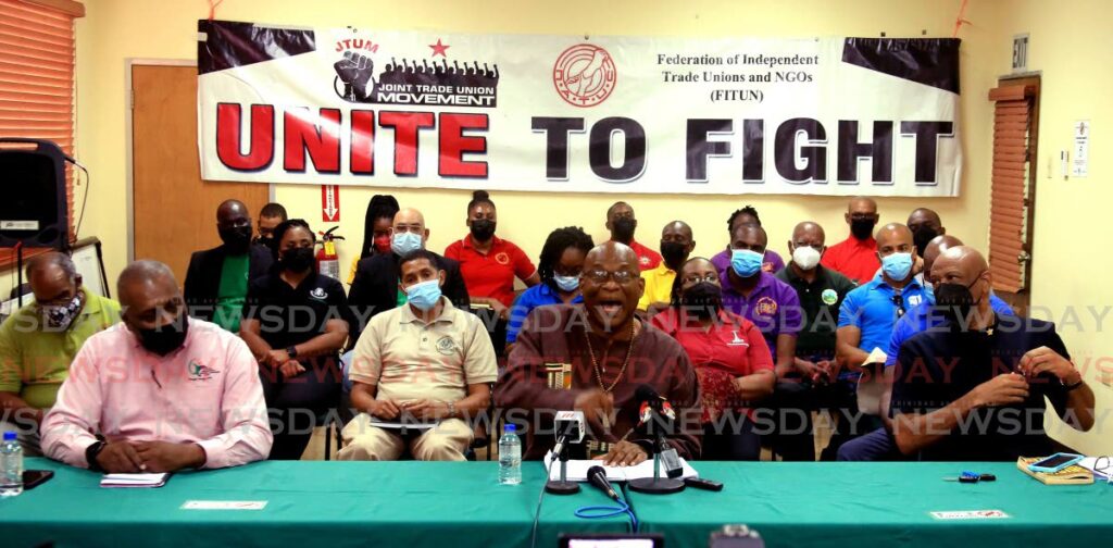 NATUC's general secretary Michael Annisette (centre) with fellow trade union leaders announcing their plans for Labour Day 2022 celebrations at a press conference at Banking, Insurance and General Workers Union head office in Barataria. - Photo by Sureash Cholai