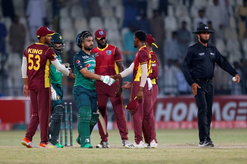 Pakistan’s Khushdil Shah, centre, and teammate Mohammad Nawaz, second left, shake hands with West Indies players after Pakistan won the match during the first one day international, at the Multan Cricket Stadium, in Multan, Pakistan, on Wednesday. (AP Photo) 