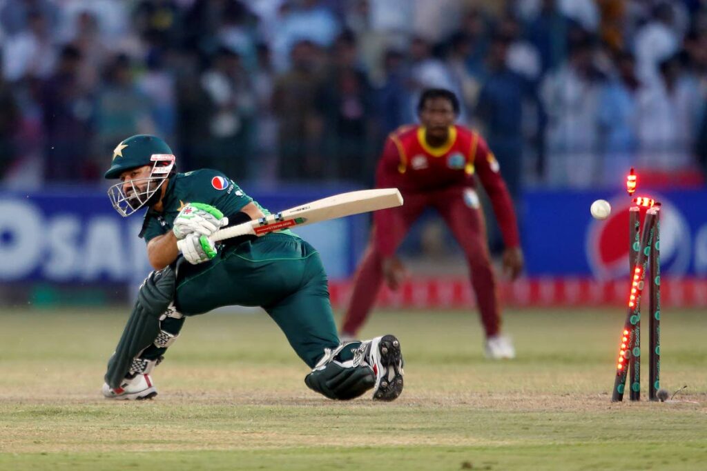 Pakistan's Mohammad Rizwan is bowled by West Indies Akeal Hosein during the second one-day international at the Multan Cricket Stadium, in Multan, Pakistan, on Friday. (AP Photo) - 