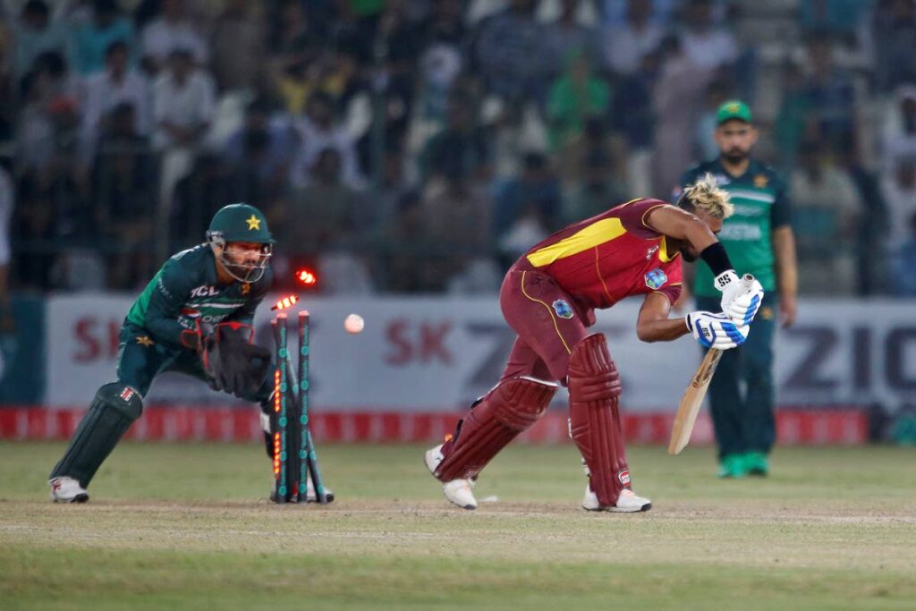 West Indies' Nicholas Pooran (centre), is bowled by Pakistan's Mohammad Nawaz during the second One-Day International between Pakistan and West Indies at the Multan Cricket Stadium, in Multan, Pakistan, on Friday. (AP PHOTO) - 