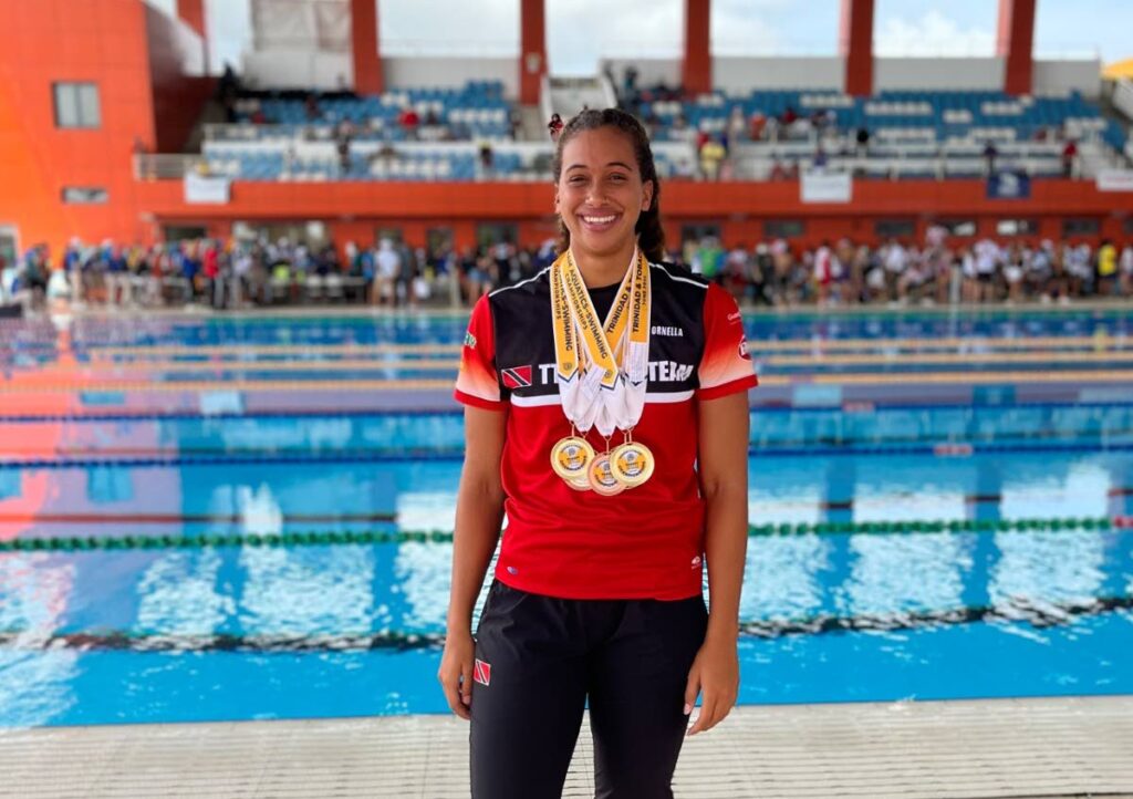 Ornella Walker with her medals at the 2022 Pan American Age Group Swimming Championships, which took place at the National Aquatic Centre, Balmain, Couva. - 