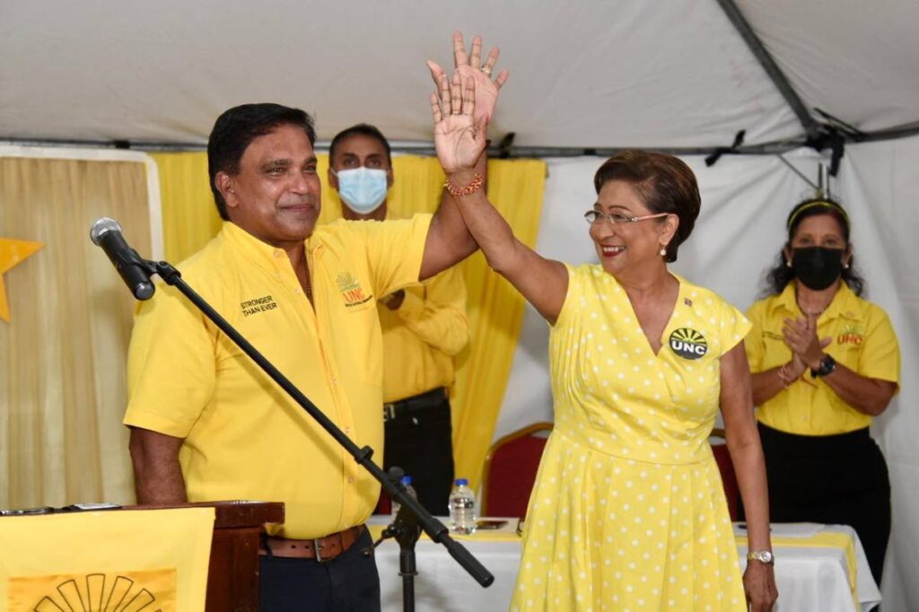 Opposition Leader Kamla Persad-Bissessar and Oropouche East MP Roodal Moonilal wave to supporters at the launch of her campaign slate for the UNC internal election in Barrackpore on June 10.  Photo courtesy UNC