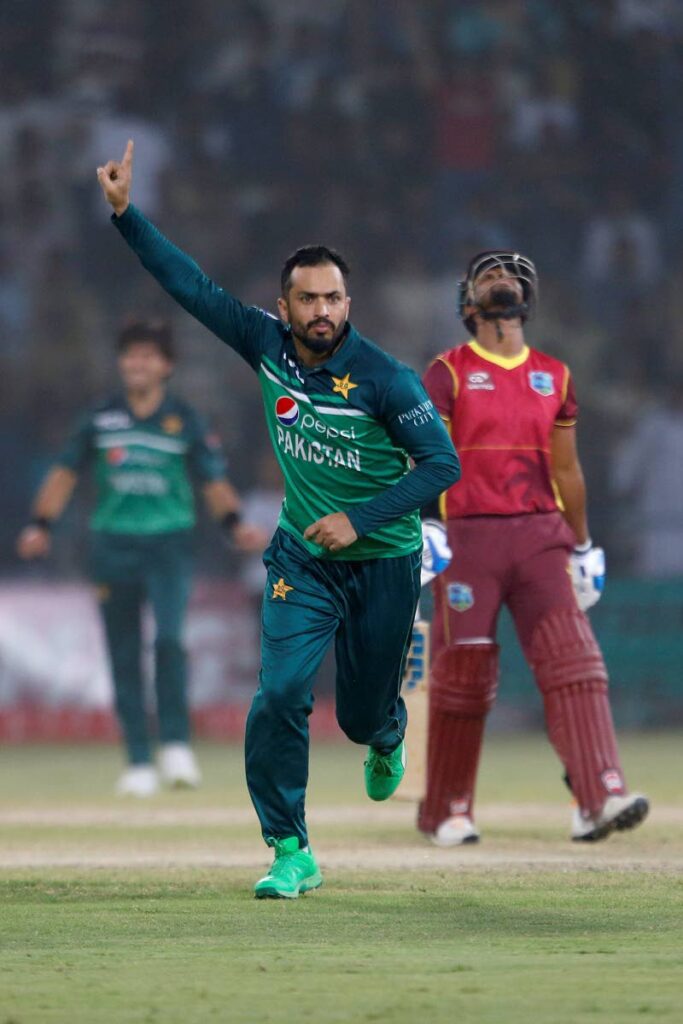 Pakistan’s Mohammad Nawaz, centre, celebrates after taking the wicket of West Indies’ skipper Nicholas Pooran, right back during the third one day international at the Multan Cricket Stadium, in Multan, Pakistan, on Sunday. - (AP PHOTO)