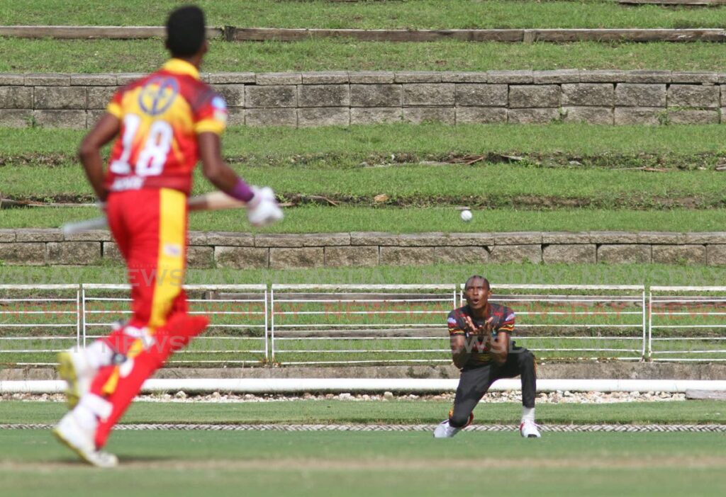 Khary Pierre (left) of Scarlet Ibis Scorchers is caught at the deep by Keon Isaac of Leatherback Giants during their teams' match in the TTCB Dream XI T10 Blast, on Sunday, at the Brian Lara Cricket Academy, Tarouba. - Marvin Hamilton