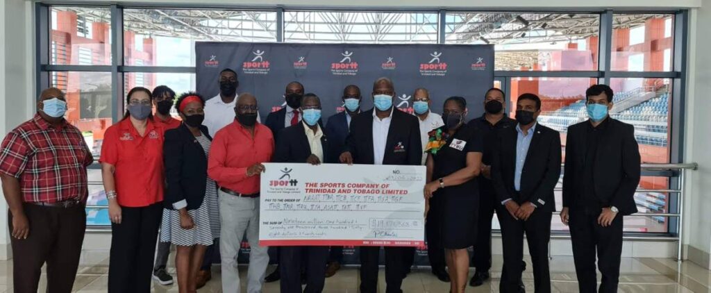 National sporting bodies are presented with a cheque worth over $19 million from Sport Company of TT officials. - 