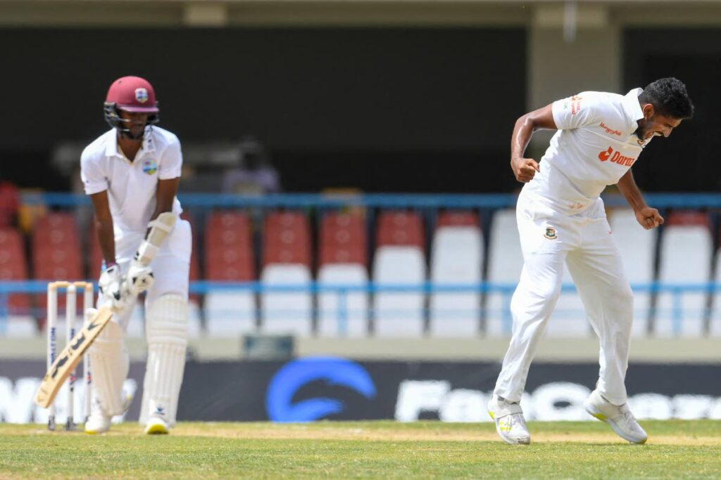 Syed Khaled Ahmed (right) of Bangladesh celebrates the dismissal of Kraigg Brathwaite (left) of West Indies during the 2nd day of the 1st Test between Bangladesh and West Indies at Vivian Richards Cricket Stadium in North Sound, Antigua, on Friday. (AFP PHOTO) - 