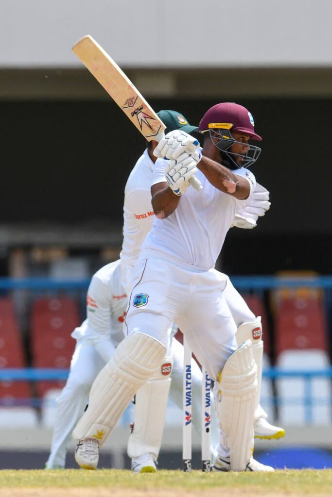 John Campbell, of West Indies, hits a four during the fourth day of the 1st Test between Bangladesh and West Indies at Vivian Richards Cricket Stadium in North Sound, Antigua on Sunday. (AFP PHOTO) - 