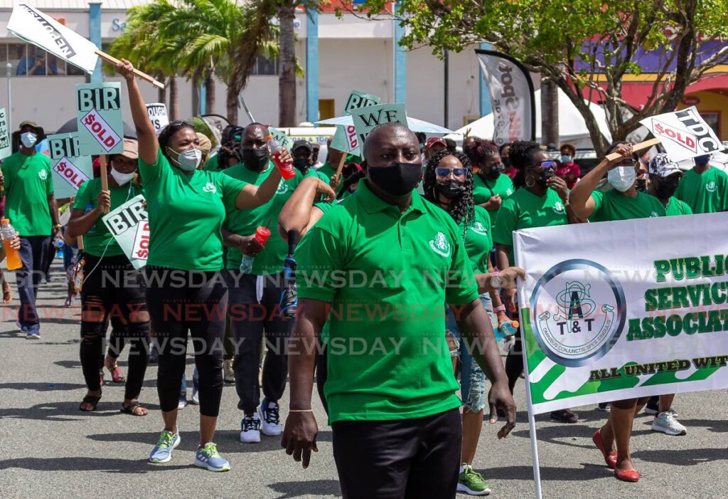 Hayden Duke, front, PSA industrial relations officer, Tobago region, leads PSA members during Sunday's Labour Day march and rally from Lowlands to Scarborough. - David Reid
