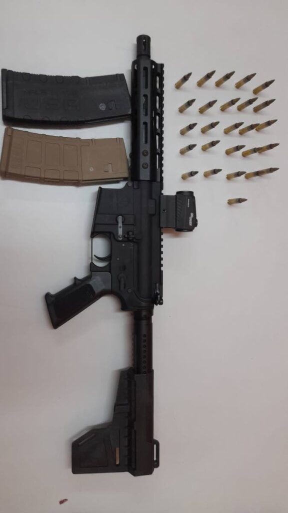 An AR 15 and 26 rounds of 5.56 ammunition were found and seized by police at a house on Leotaud Street, Morvant. 

PHOTO COURTESY TTPS