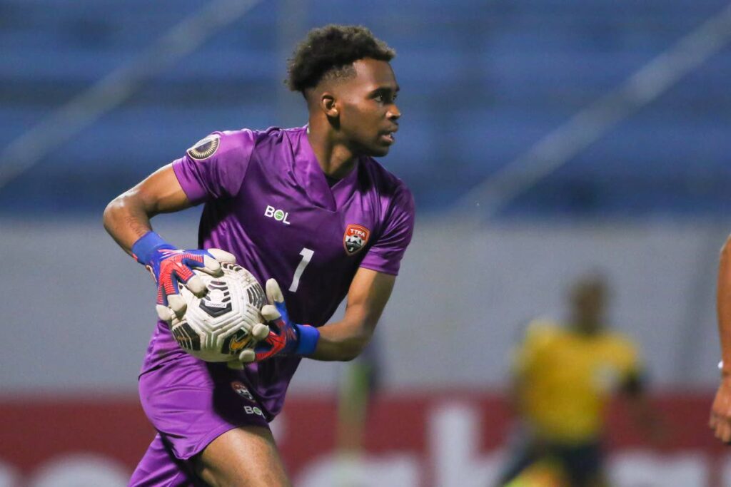Trinidad and Tobago under-20 goalie Jahiem Wickham looks to distribute the ball against Mexico in the Concacaf U-20 Championship at the Francisco Morazán stadium in San Pedro Sula, Honduras, Tuesday. - MIGUEL GUTIERREZ/CONCACAF