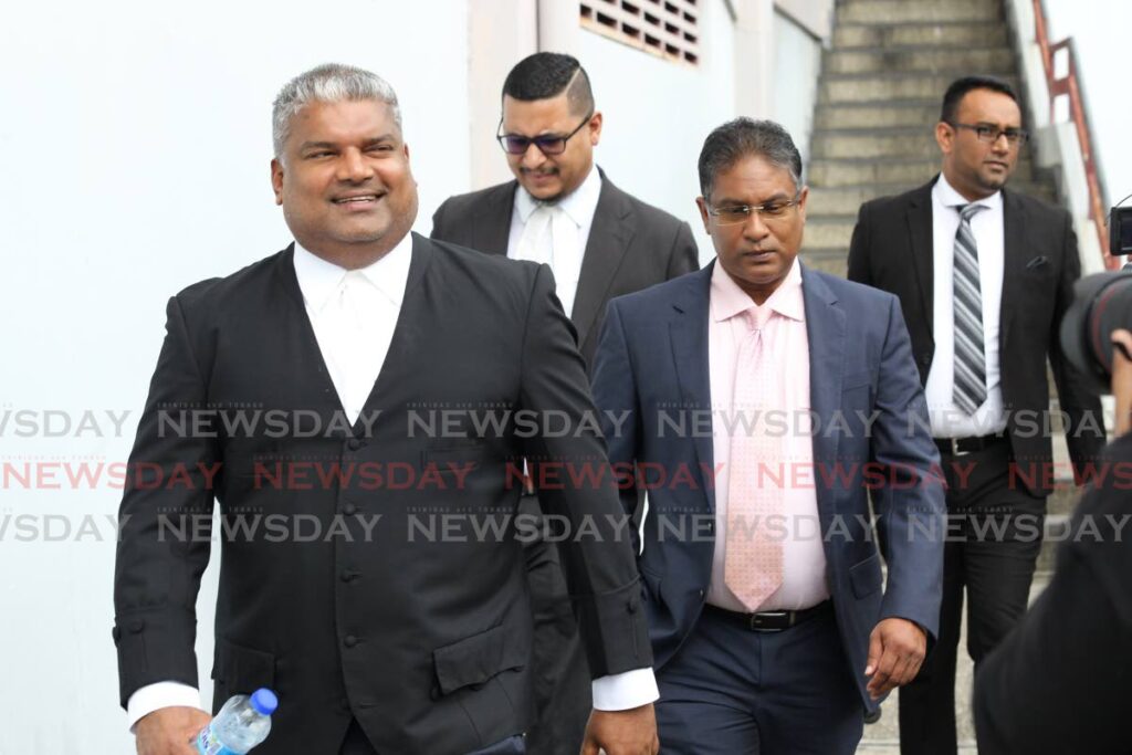 Former attorney general Anand Ramlogan, SC, (left) leaves the San Fernando High Court, in January 2020, with his client ex-Central Bank governor Jwala Rambarran (right) after a hearing of the lawsuit Rambarran filed against Finance Minister Colm Imbert for wrongful dismissal. - 