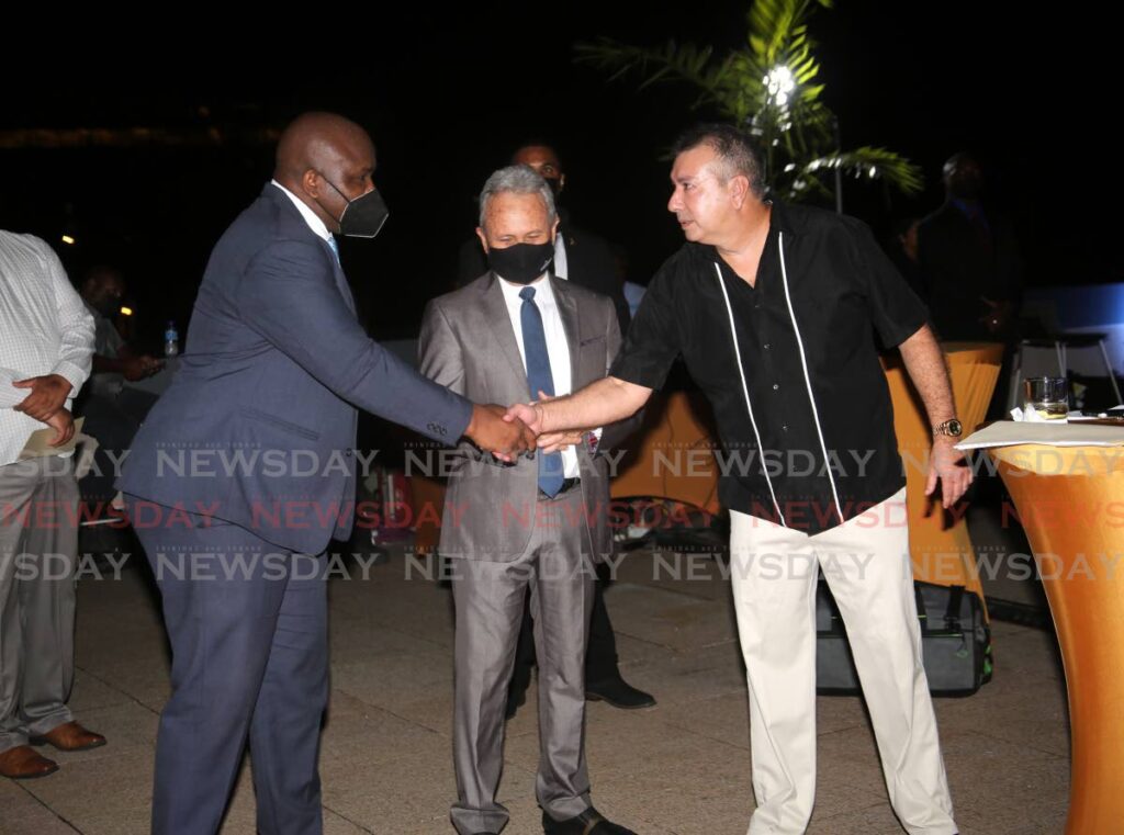Minister in the Ministry of Finance Brian Manning, from left, acting PM Colm Imbert and National Insurance Board (NIB) chairman Patrick Ferreira greet at the NIB 50th annivesary reception, head office Queen’s Park Savannah East, Port of Spain, on Friday. - SUREASH CHOLAI