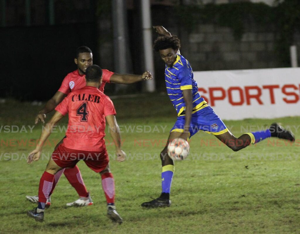 Real West Fort United striker Akel La Borde (R) takes a shot at goal during his team’s match-up against Terminix La Horquetta Rangers FC at La Horquetta on Friday.  - Angelo Marcelle