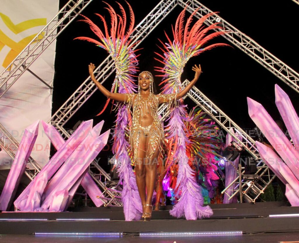 Model Athaliah Samuel crossed the stage while displaying a carnival costume from the section Drip during Yumas's band launch, Awakened Treasure at Drew Manor, Santa Cruz. - Photo by Ayanna Kinsale