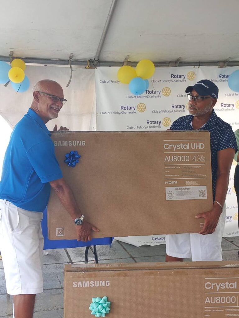 Medical Associates won two Samsung televisions after their team including Neville Mohammed and Dr Aroon Narayansingh won the Rotary Club of Felicity/Charlieville's Charity Golf tournament, on Sunday, at the Millienieum Lakes Golf Club, Trincity. - Photo by David Scarlett