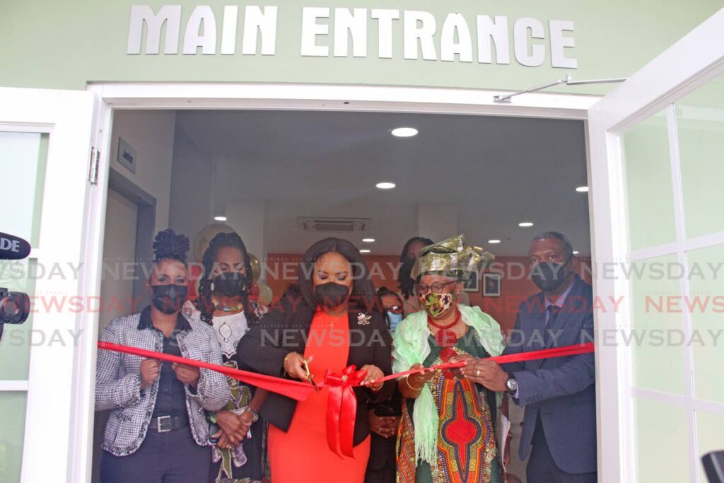 Ministerof Sport and Community Development, Shamfa Cudjoe, cuts the ribbon for the opening of the Lisas Gardens Community Centre in Couva on Tuesday. - Marvin Hamilton