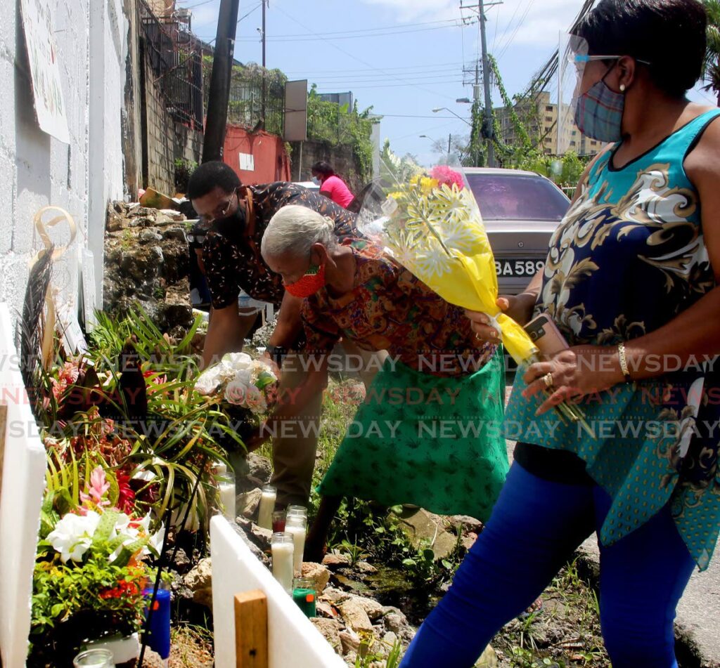 In this file photo, relatives of the three men killed by police in 2020 remember them duing the second memorial on June 27, at Juman Drive, Second Caledonia, Morvant at the spot they were shot dead. - SUREASH CHOLAI