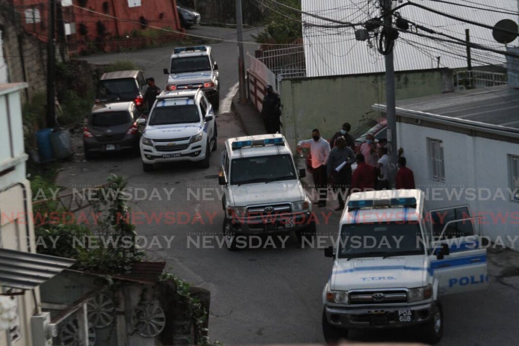 FILE PHOTO: Investigators conduct a re-enactment of the police-involved killing of Joel Jacob, Noel Diamond and Israel Moses Clinton at Juman Drive, Second Caledonia Morvant on July 30, 2021. The killings happened almost a year earlier on June 27, 2020. - Marvin Hamilton