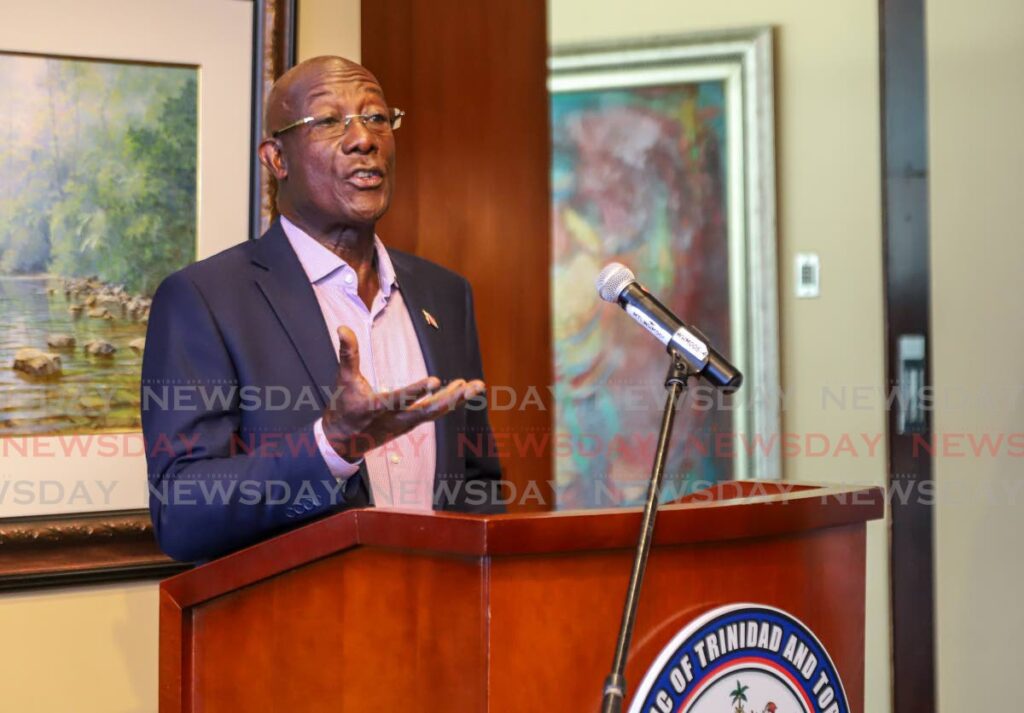 Prime Minister Dr Keith Rowley addresses the media at the VIP Lounge, Piarco International Airport on April 21. - FILE PHOTOS/JEFF MAYERS