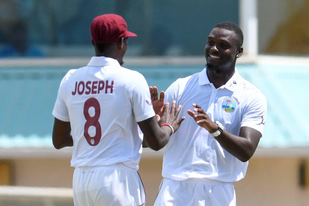 Jayden Seales (right) of West Indies celebrates with his teammate Alzarri Joseph after dismissing Shakib Al Hasan of Bangladesh during the first day of the 2nd Test at Darren Sammy Cricket Ground, Gros Islet, St Lucia, on June 24. (CWI Media) - 