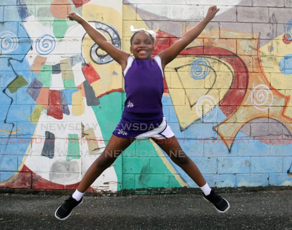 Kelsea Jacob does a star jump at Queen's Park Savannah, Port of Spain. - AYANNA KINSALE