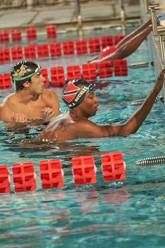 Mark-Anthony Beckles (front) after his gold medal swim in the men's 50-metre freestyle at the 2022 Caribbean Games in Guadeloupe on Thursday. PHOTO COURTESY CARIBBEAN GAMES WEBSITE. - 