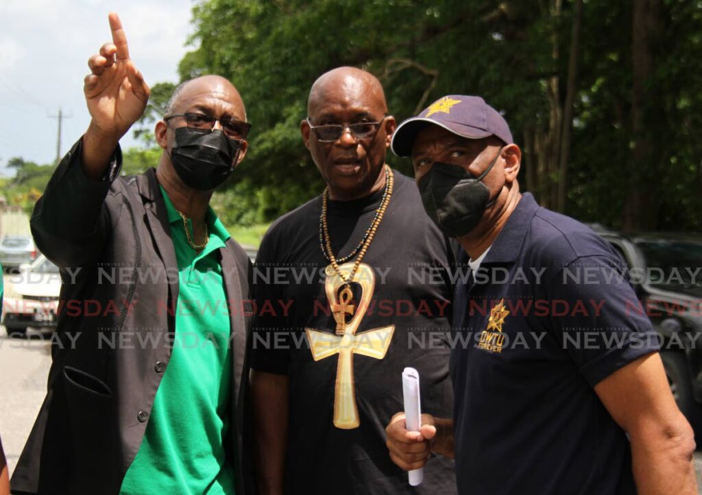 GO SO: From left, PSA president Leroy Baptiste, Natuc head Michael Annisette and OWTU president general Ancel Roget in discussions at the Jtum motorcade on Sunday. PHOTO BY MARVIN HAMILTON - 