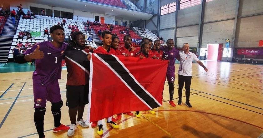 The TT men's futsal team pose for a photo after earning bronze at the 2022 Caribbean Games in Guadeloupe, on Sunday. - 