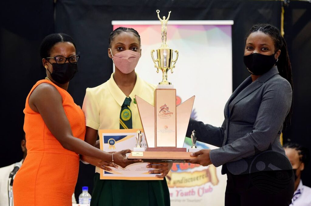 Signal Hill Secondary student J'Nae Brathwaite, centre, collects her trophy from Secretary of Tourism Tashia Burris, right, after being named Junior Secretary at the Tourism Youth Congress on Friday, Anne Mitchell-Gift auditorium, Scarborough library.  - THA