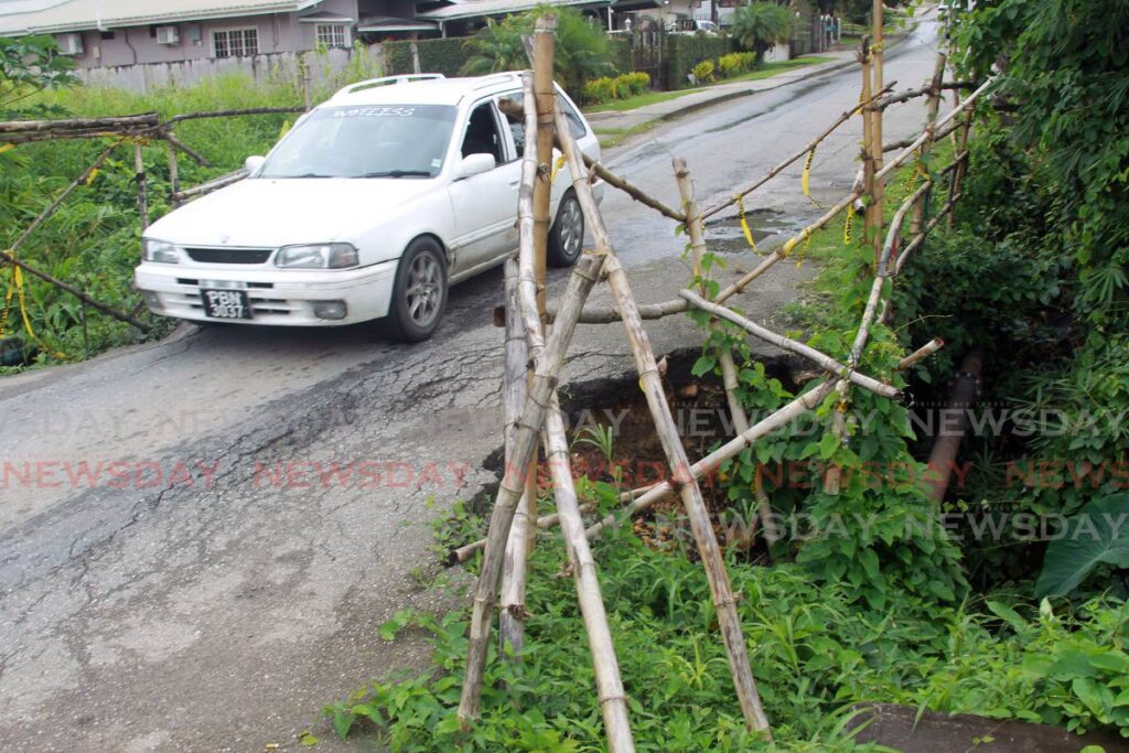 A driver cautiously passes the area on the Cipero Road, Borde Narve Village, Lengua where a Bailey bridge is to be installed. - Lincoln Holder