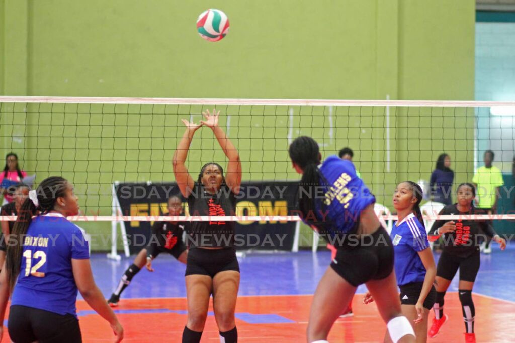 TT player Zhane Marie Lezama (centre) tries to defend a shot against the US Virgin Islands in the CAZOVA Championships, at the Southern Indoor Sports Arena, Pleasantville. - Marvin Hamilton