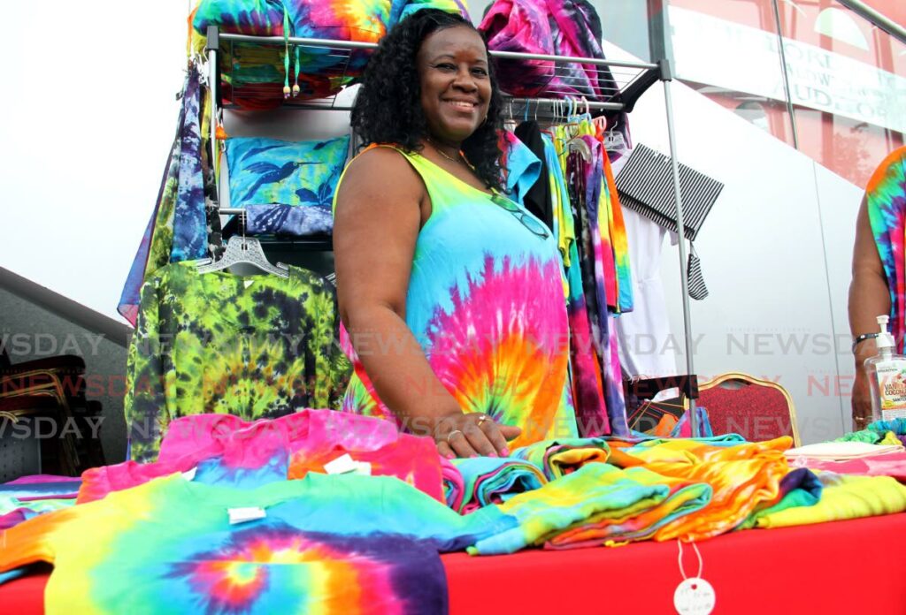 Marilyn Williams of Lynplus Xclusiv Designs with some colourful designs at her booth at the National Academy for the Performing Arts on Friday. - AYANNA KINSALE