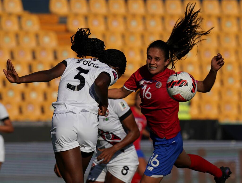 Trinidad and Tobago's Cecily Stoute (left), and Costa Rica's Katherine Alvarado, battle for the ball during a CONCACAF Women's Championship match in Monterrey, Mexico, on Friday. (AP PHOTO) - 