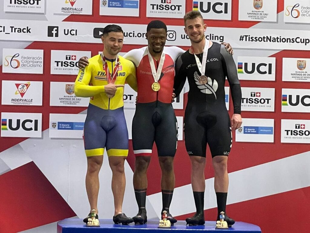 TT's Nicholas Paul, centre, celebrates his Tissot UCI Track Nations Cup men's keirin gold atop the podium in Cali, Colombia alongside silver medallist Jai Angsuthasawit of Thailand, left, and bronze receiver Sam Dakin of New Zealand. - 