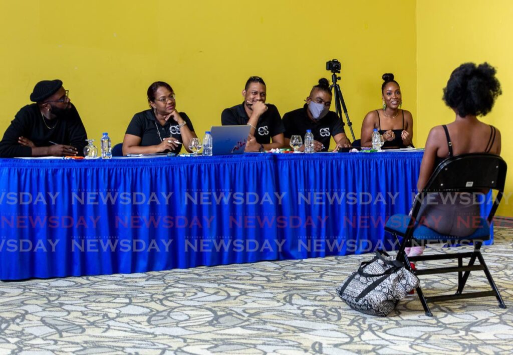 A Miss Trinidad and Tobago Universe aspirant is interviewed by the screening panel at Shaw Park on Saturday. File photo/David Reid