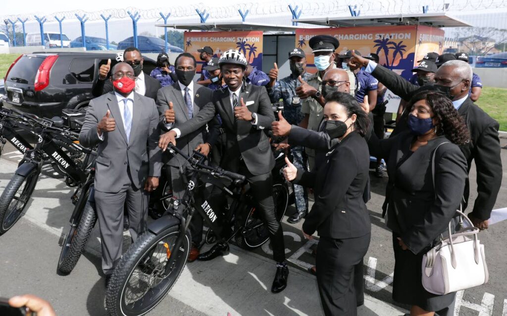 Chief Secretary Farley Augustine (centre) sits on one of the new e-bikes donated by the US.  Looking on at the hand-over ceremony at the Shirvan Road Police Station on Monday are acting CoP McDonald Jacob, Charge D'Affaires at the US Embassy, Port of Spain Shante Moore, Sgt Samuel Quamina, Minister of National Security Fitzgerald Hinds, acting ACP Daniel Moore, Amcham president Toni Sirju-Ramnarine, and chief administrator Ethlyn John.  Photo courtest the Tobago House of Assembly