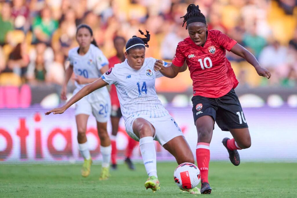 Panama's Yerenis De Leon (L) and TT's Asha James vie for the ball during the Concacaf Women's Championship Grou B match, on Monday. - CONCACAF