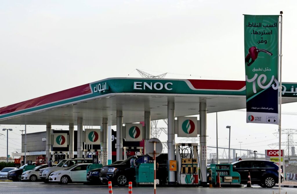 Cars fill their tanks at a gas station in Dubai, United Arab Emirates on July 10. Mere years ago, fuel was cheaper than bottled water in the oil-rich United Arab Emirates. Now, long lines snake outside gas stations on the eve of monthly price hikes. (AP PHOTO)