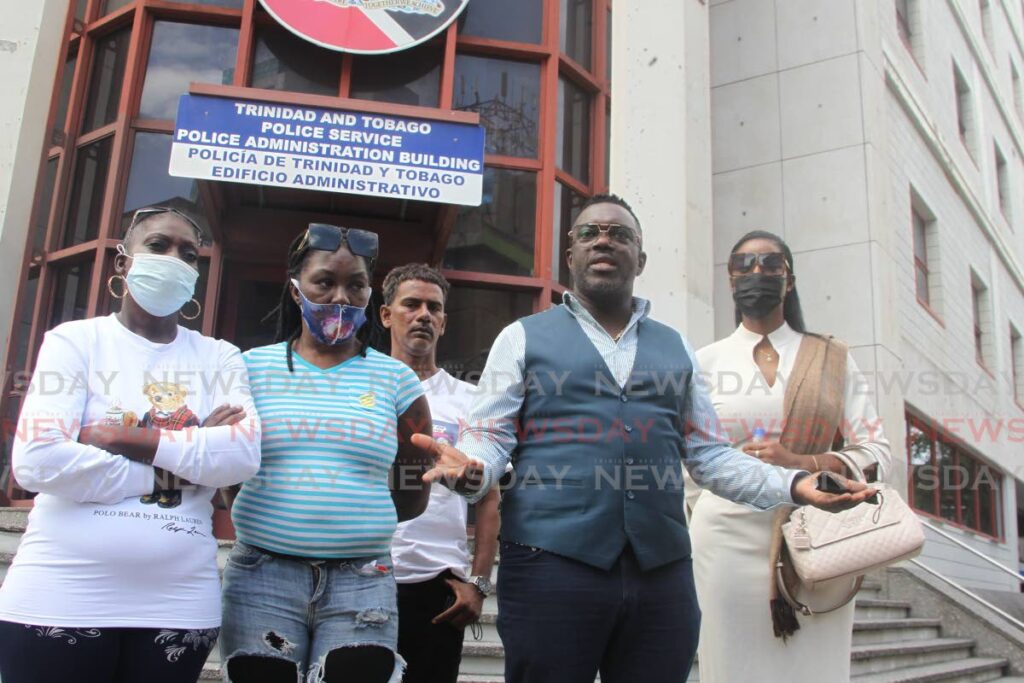 Political Leader of the PDP Watson Duke  leaves the offices of Commissioner of Police McDonald Jacob alongside relatives of the victims at the Police Administration Building, Sackville Street Port of Spain. Photo by Roger Jacob