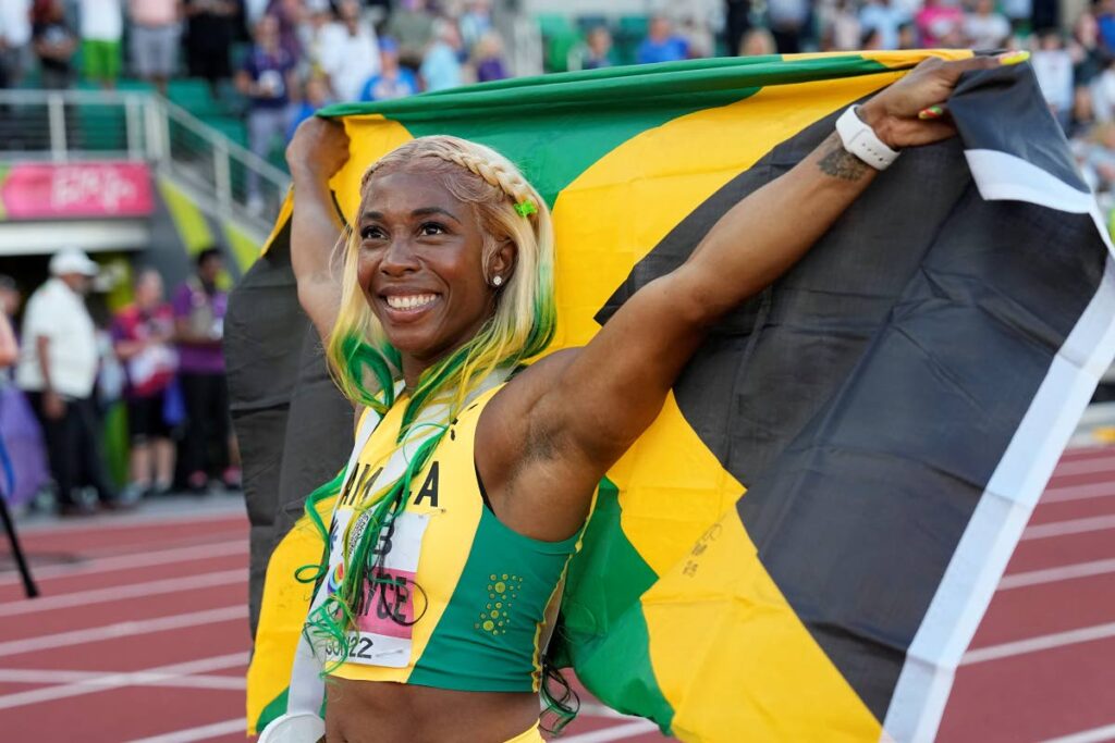 Shelly-Ann Fraser-Pryce, of Jamaica, reacts after winning gold in the final in the women's 100m at the World Athletics Championships on Sunday, in Eugene, Ore. (AP Photo) - 