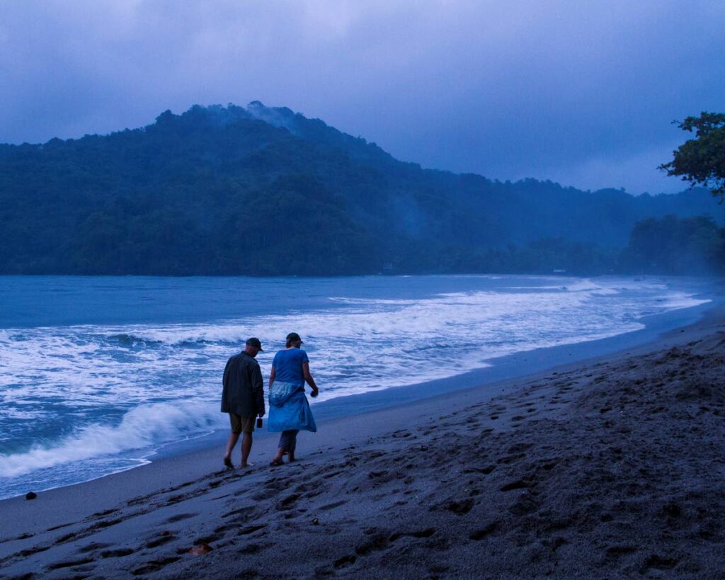Two birders return to their lodge after witnessing the release of leatherback hatchlings at Grande Riviere.  - Faraaz Abdool