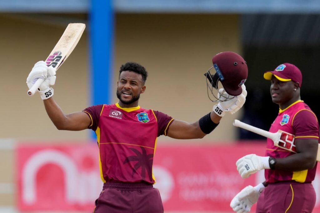 West Indies' Shai Hope celebrates after he scored a century against India during the second ODI cricket match at Queen's Park Oval in St Clair, on Sunday. (AP PHOTO) - 