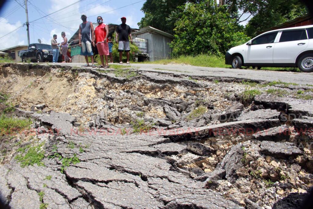 LANDSLIP DANGER: Residents of Parforce Road Extension, Gasparillo, are appealing for help to repair a landslip which is making access to their homes almost impossible.  - Lincoln Holder