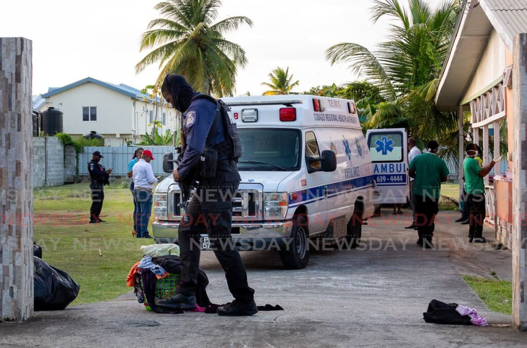 ON SITE: Police officers at the home for the elderly in Tobago as its residents were relocated. PHOTO BY DAVID REID  - 