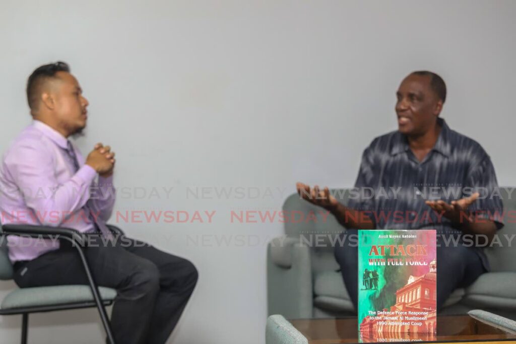 Retired Brig General Ancil Antoinie, right, during an interview with Newsday's Shane Superville on Thursday at the newspaper's Pembroke Street, Port of Spain office. - JEFF K MAYERS