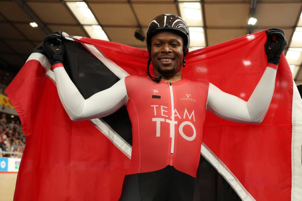 Trinidad And Tobago's Nicholas Paul celebrates as he won the men's keirin final during the Commonwealth Games track cycling at Lee Valley VeloPark in London, on Saturday. - 