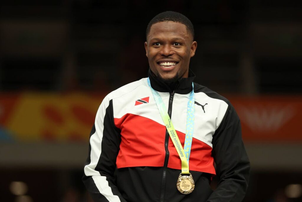 Gold medallist Trinidad and Tobago's Nicholas Paul celebrates during a medal ceremony for the men's keirin final at the Commonwealth Games track cycling at Lee Valley VeloPark in London, England on Saturday. (AP PHOTOS) - 