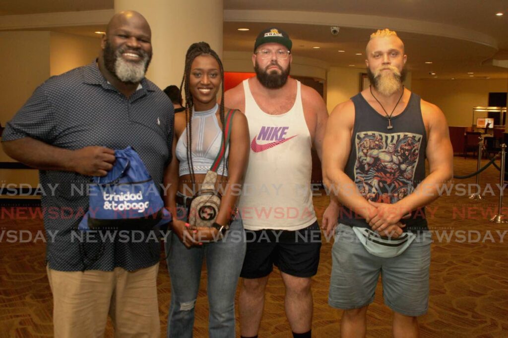 Mark Henry (left), WWE Hall of Famer and former WWE world champion, with Queen Animata (second from left) and the tag-team duo The End, at the promotional launch of Battle Kingdom, at the Hilton Hotel, St Ann's on Saturday. - ROGER JACOB